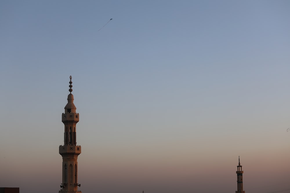 white and brown concrete tower under white sky