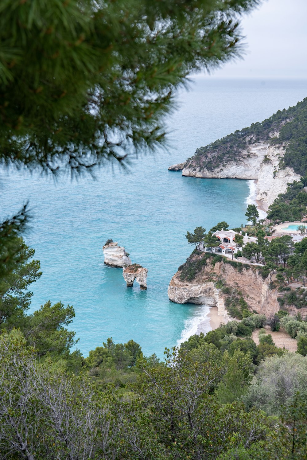 a scenic view of a beach and a body of water