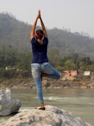 A person practicing yoga in a peaceful outdoor setting.