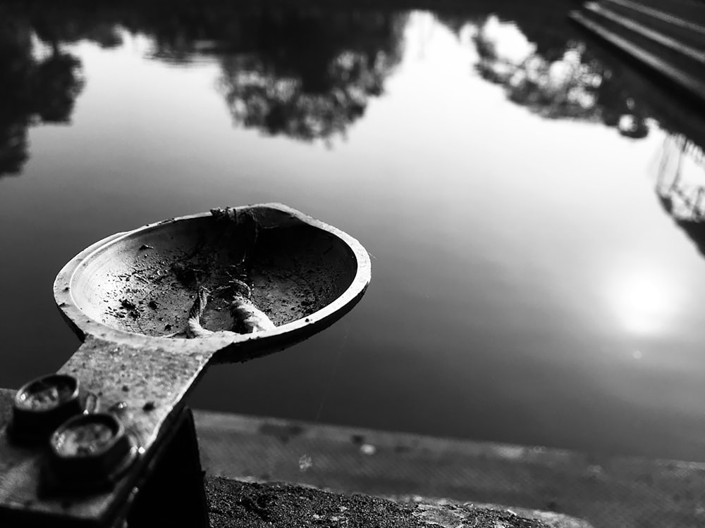 grayscale photo of water in bucket