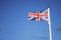 us a flag on pole under blue sky during daytime