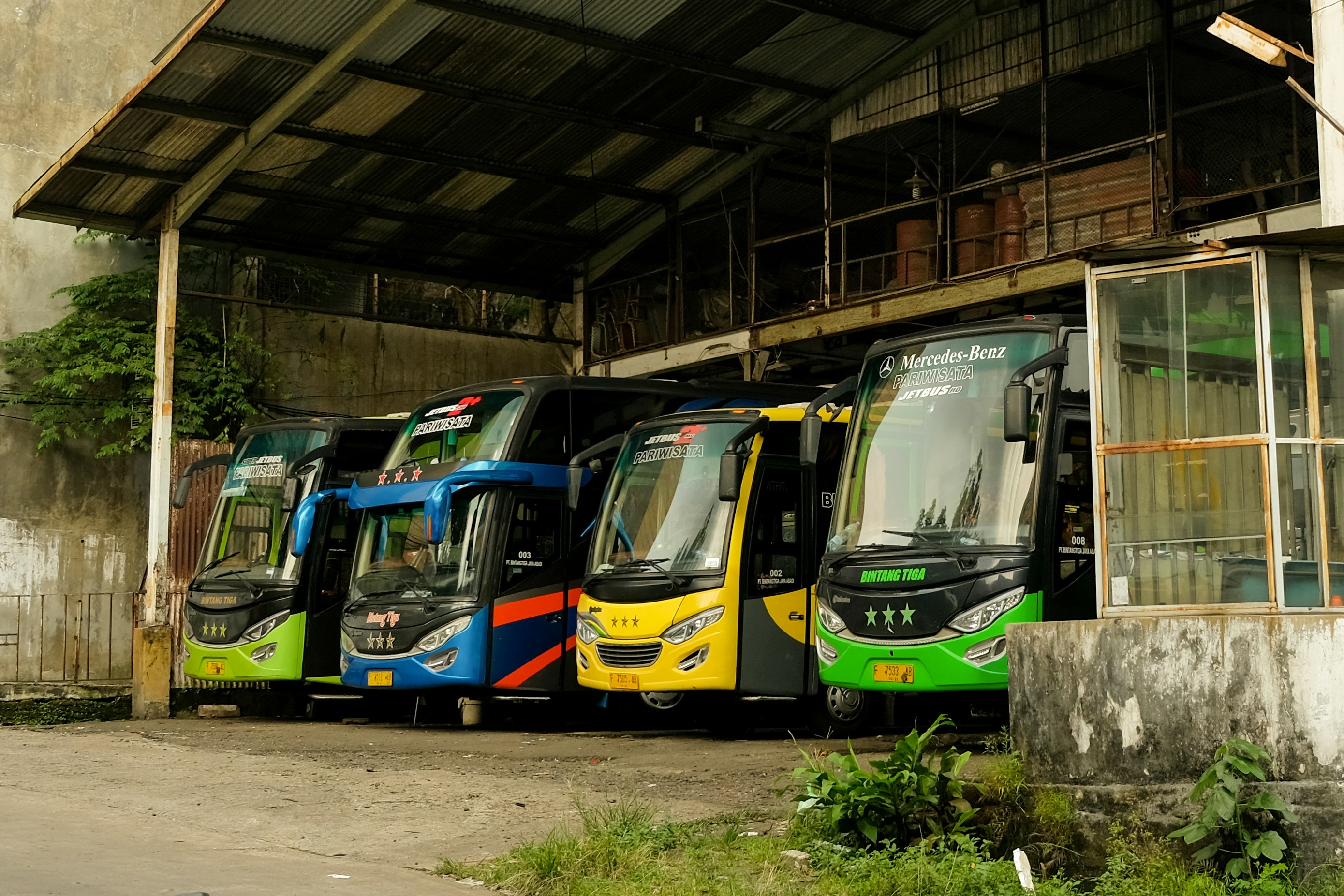 green and blue train in train station