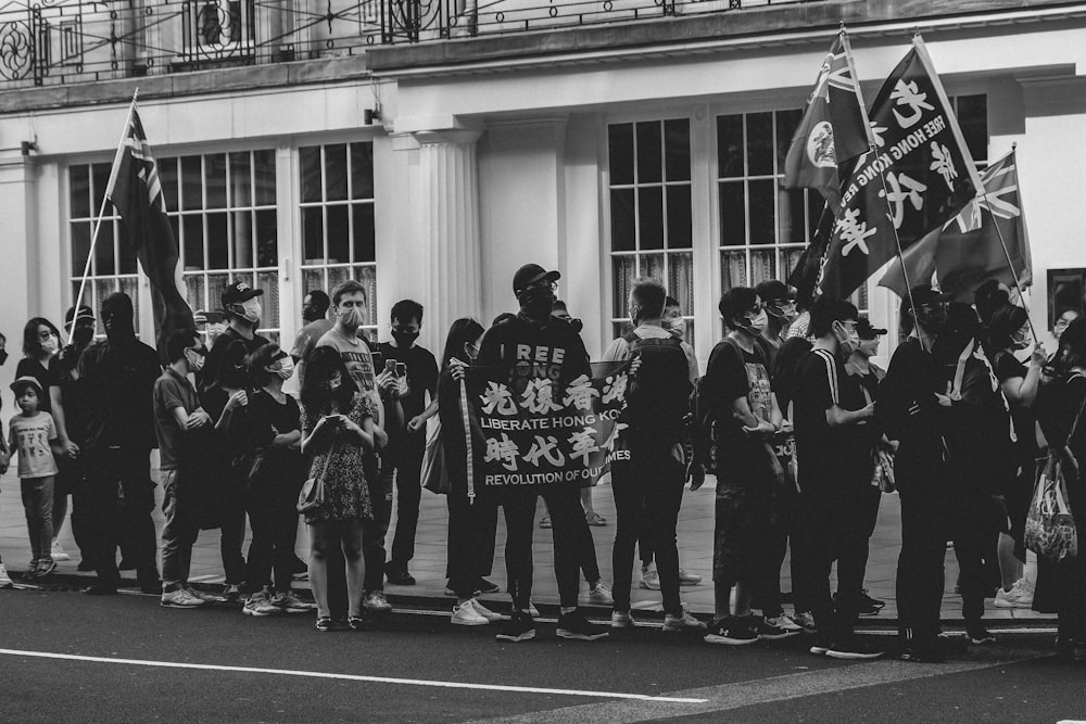 a group of people standing in front of a building