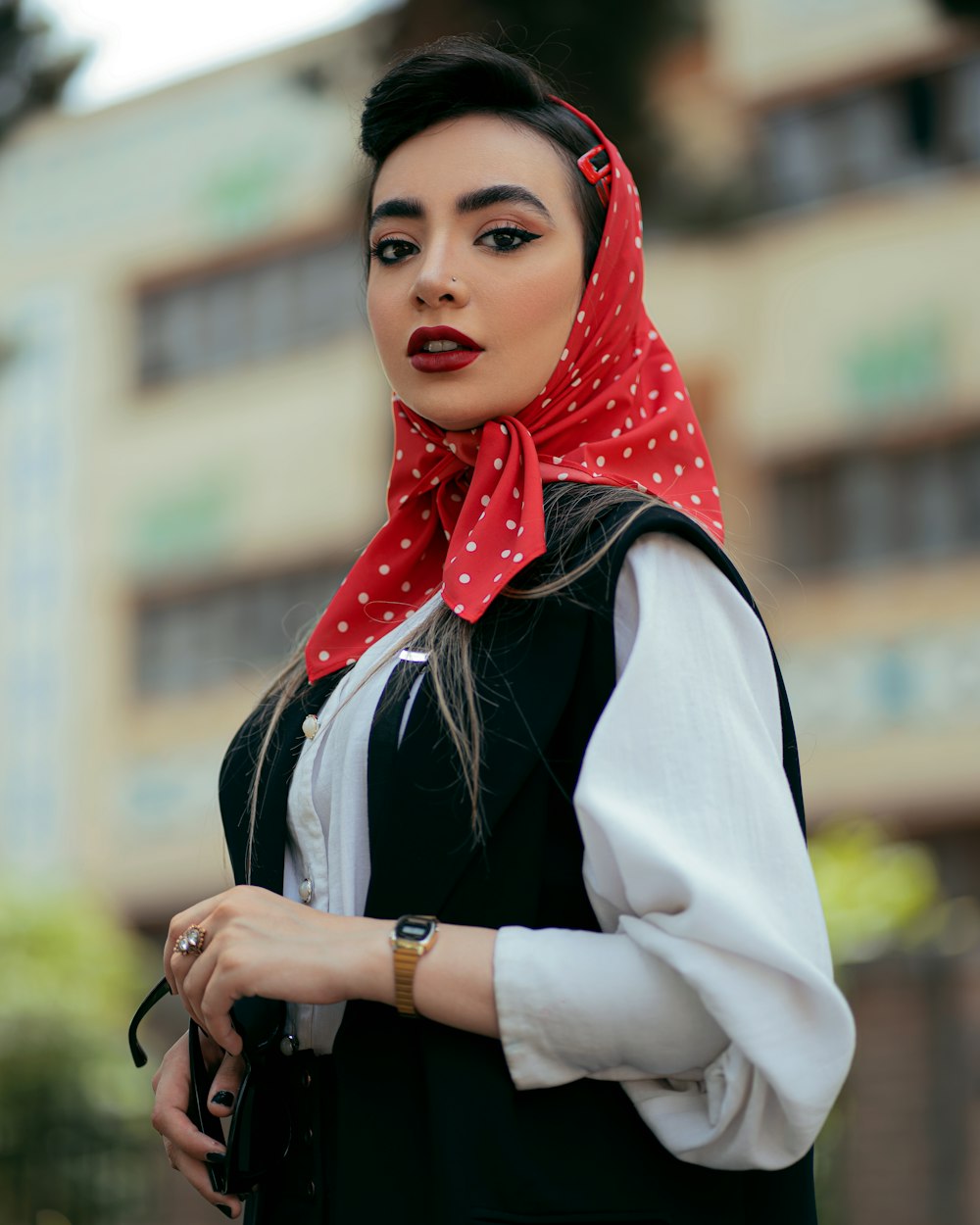 a woman with a red scarf around her neck