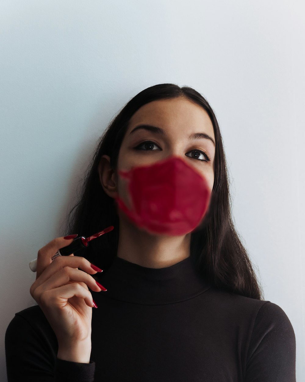 woman in black turtleneck shirt with red lipstick