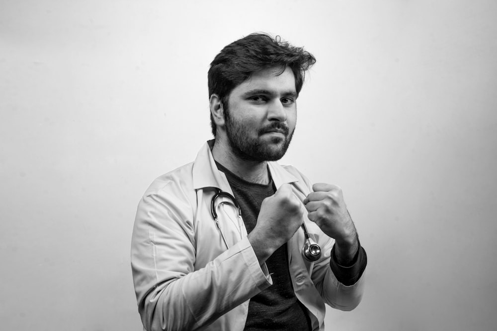 man in white dress shirt smoking cigarette