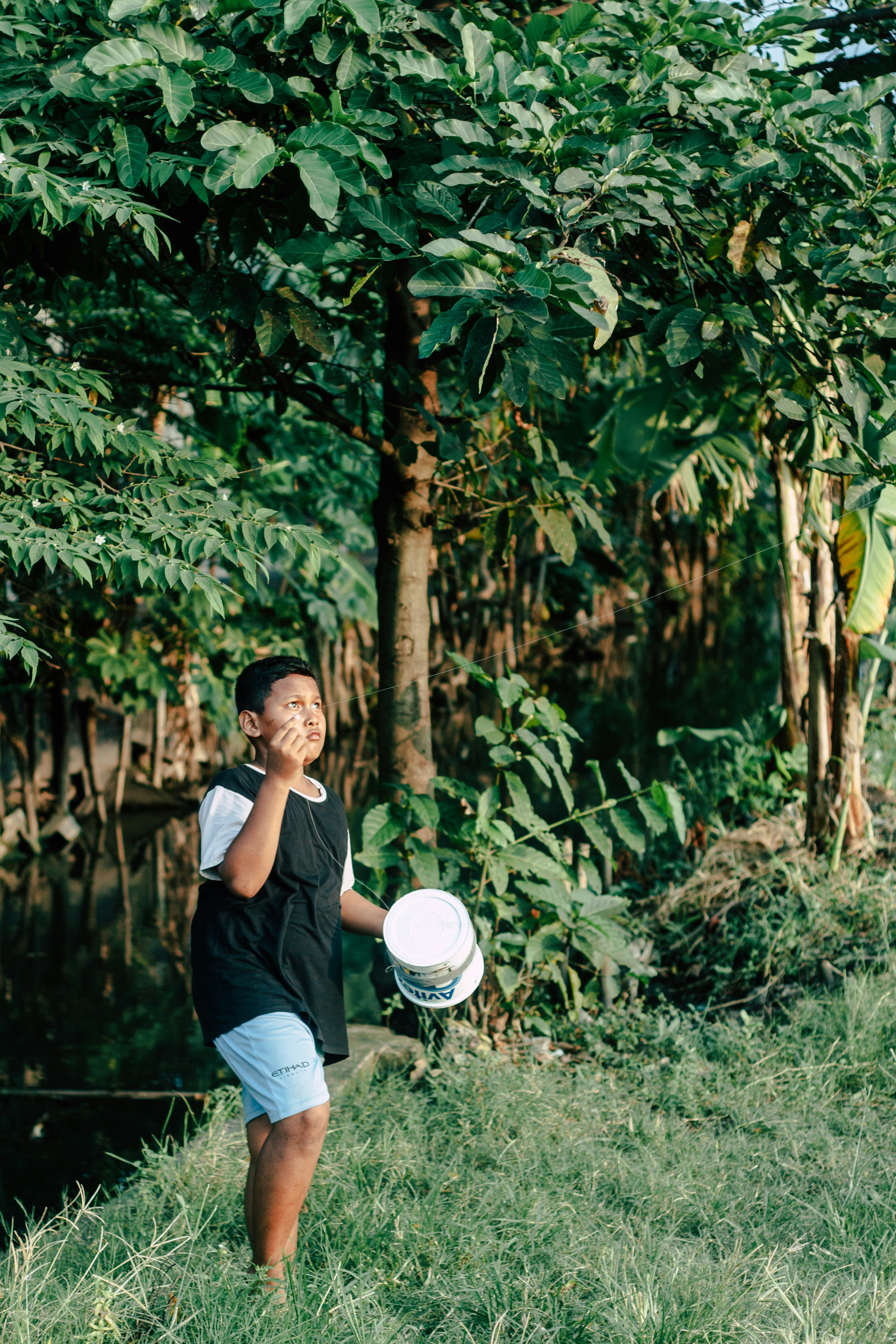 a young man holding a frisbee in his hand