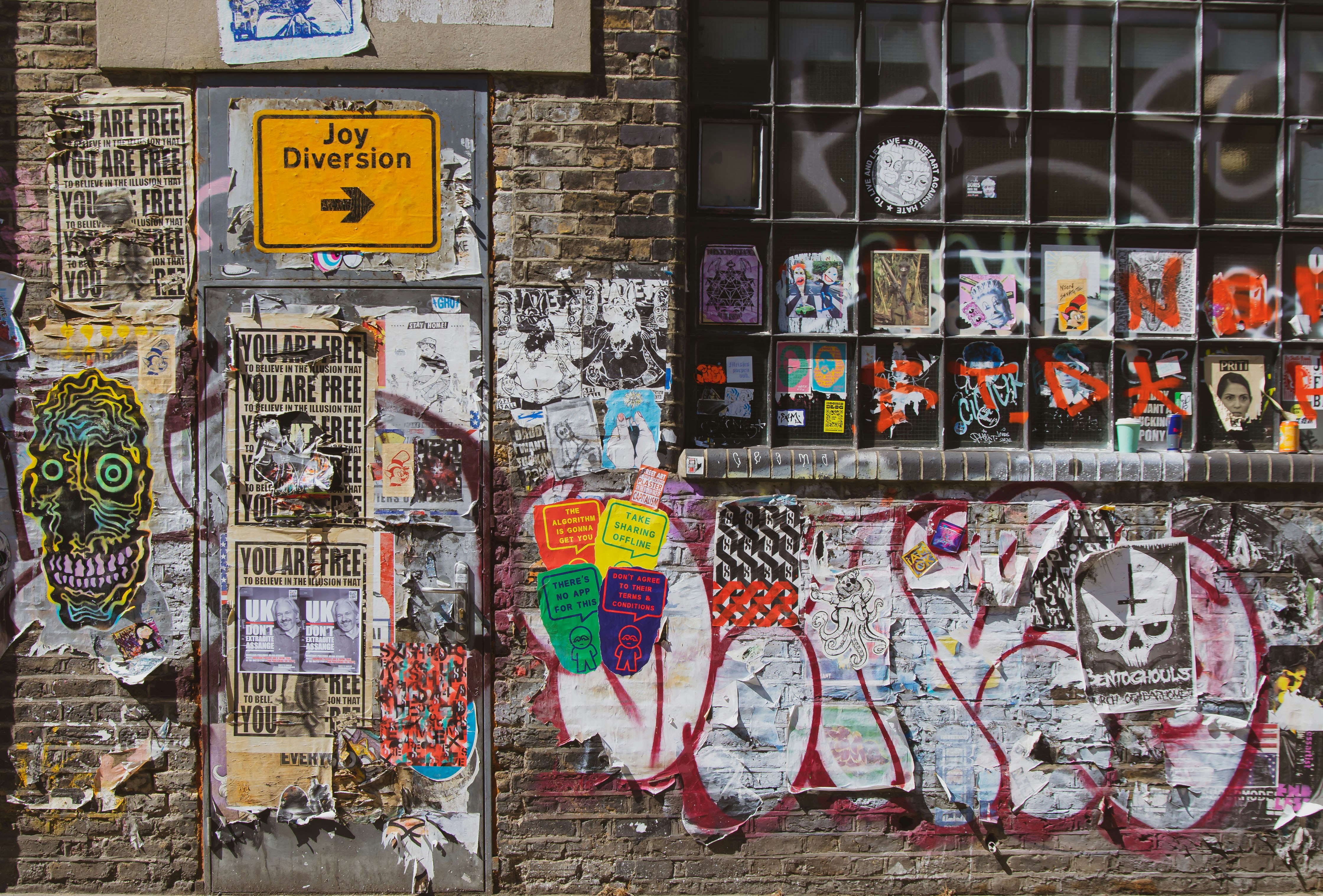 white red and yellow graffiti on wall