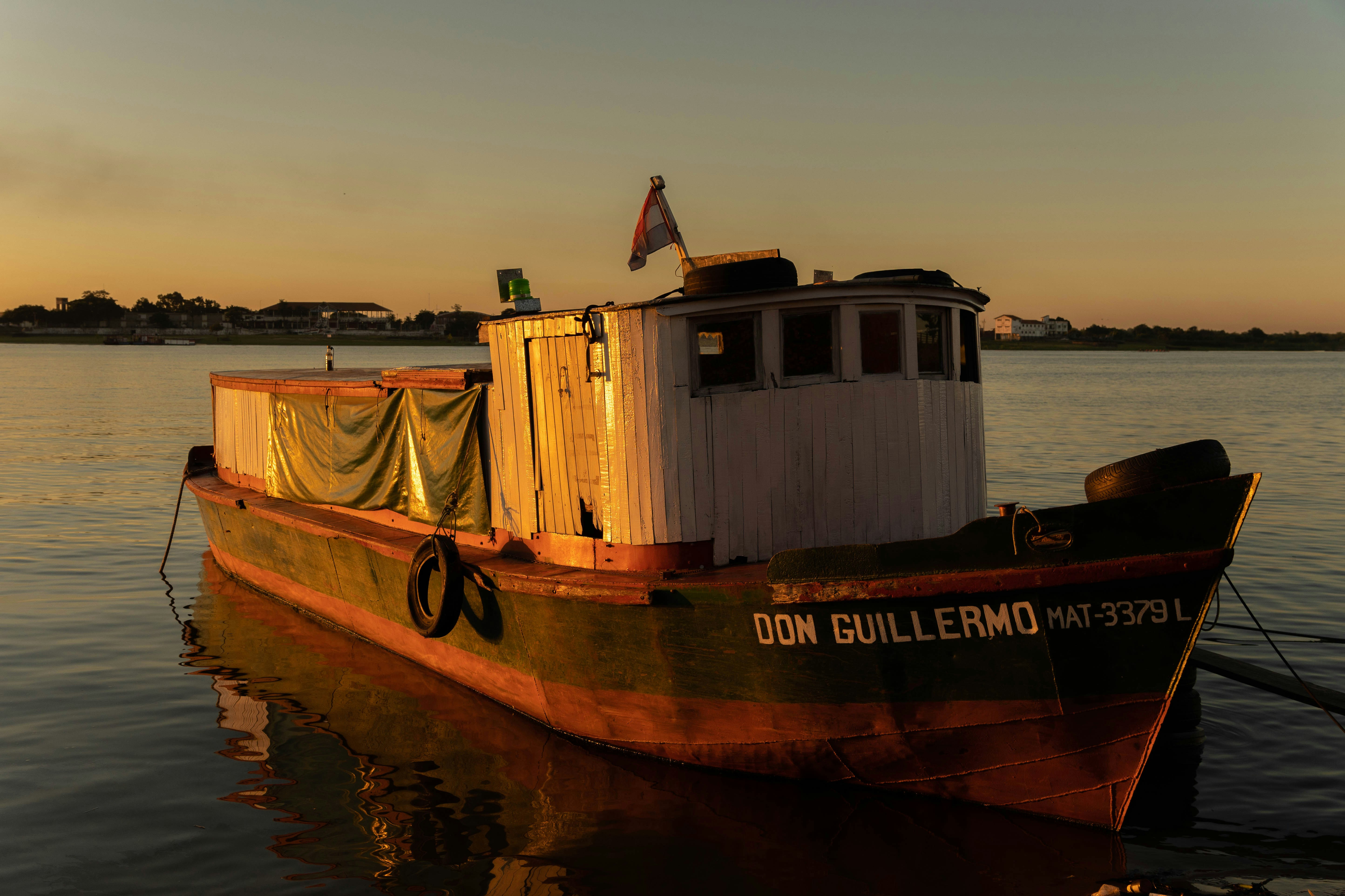 white and brown boat on water during daytime