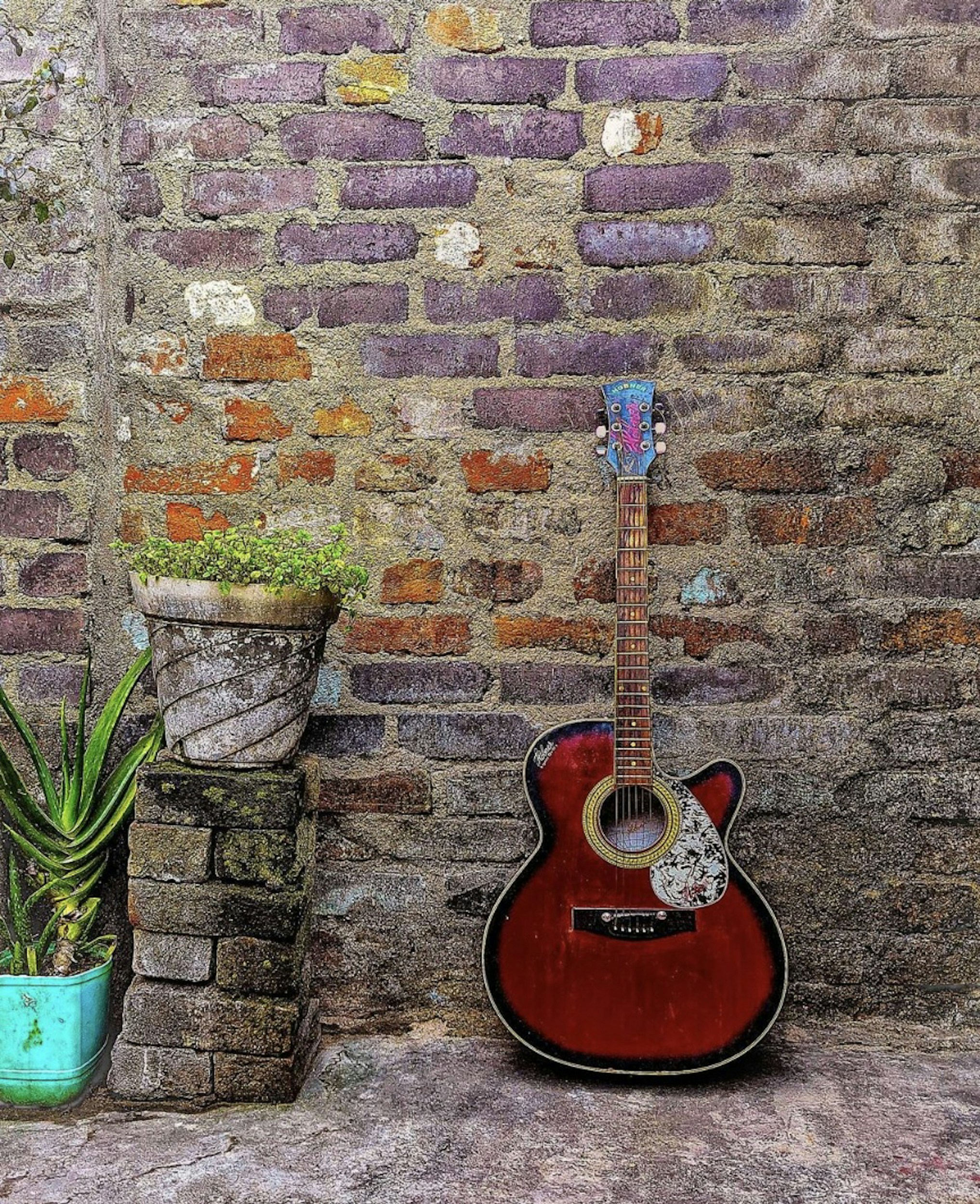 Acoustic guitar resting against wooden porch railing, warm afternoon sunlight, rustic setting
