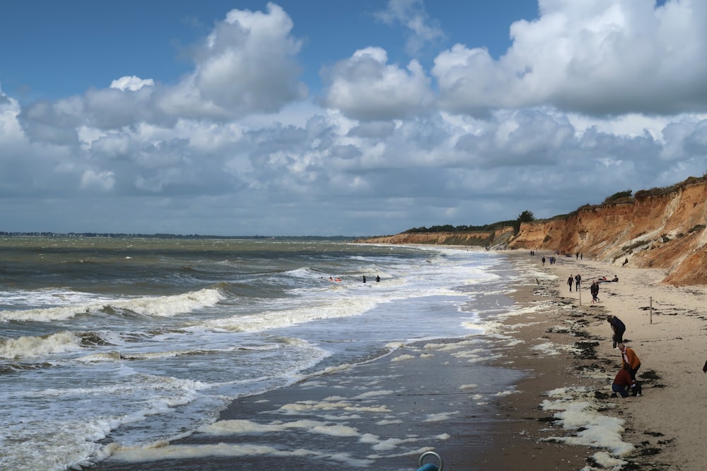 ocean waves crashing on shore during daytime