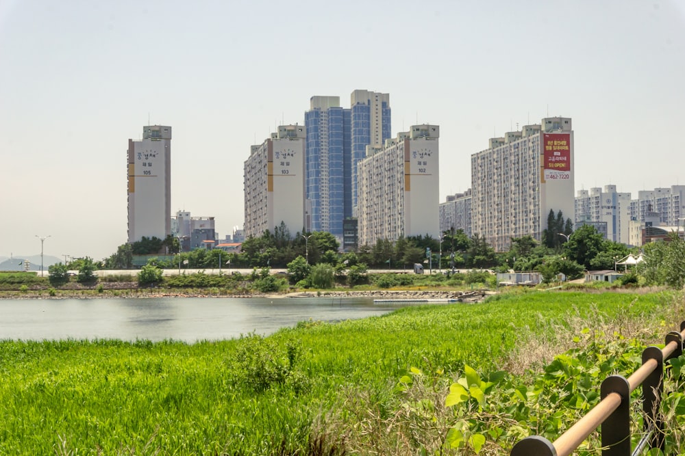 high rise buildings near river during daytime