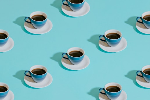 mushroom coffee in white ceramic teacup on white ceramic saucer