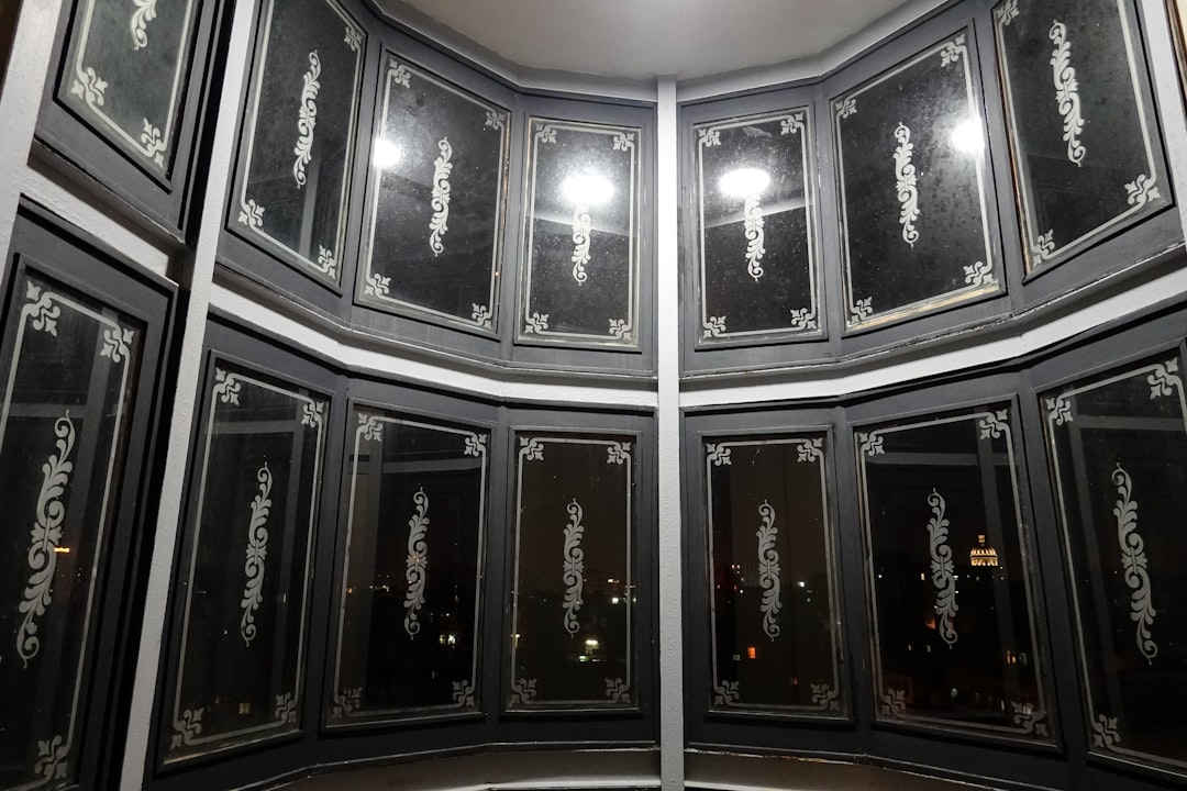 black wooden framed glass windows