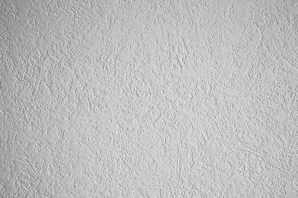 white wall paint with black round hole