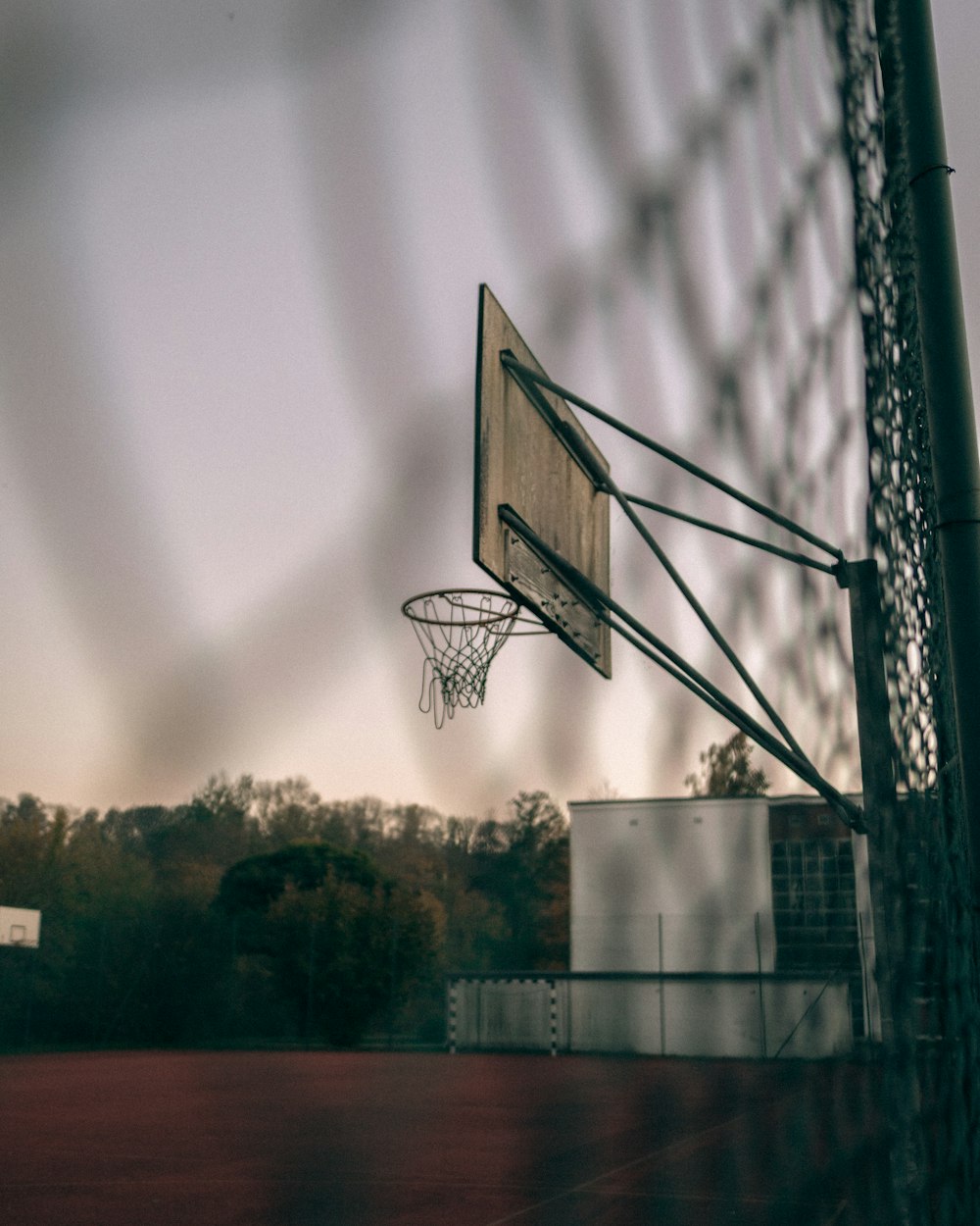 basketball hoop in grayscale photography