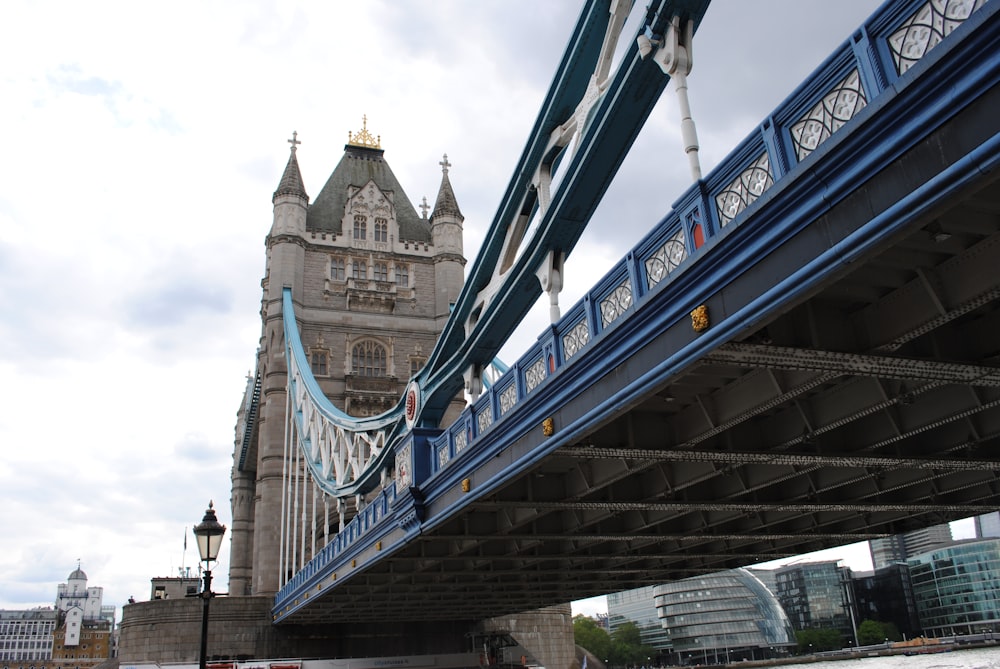 brown and gray bridge under blue sky during daytime