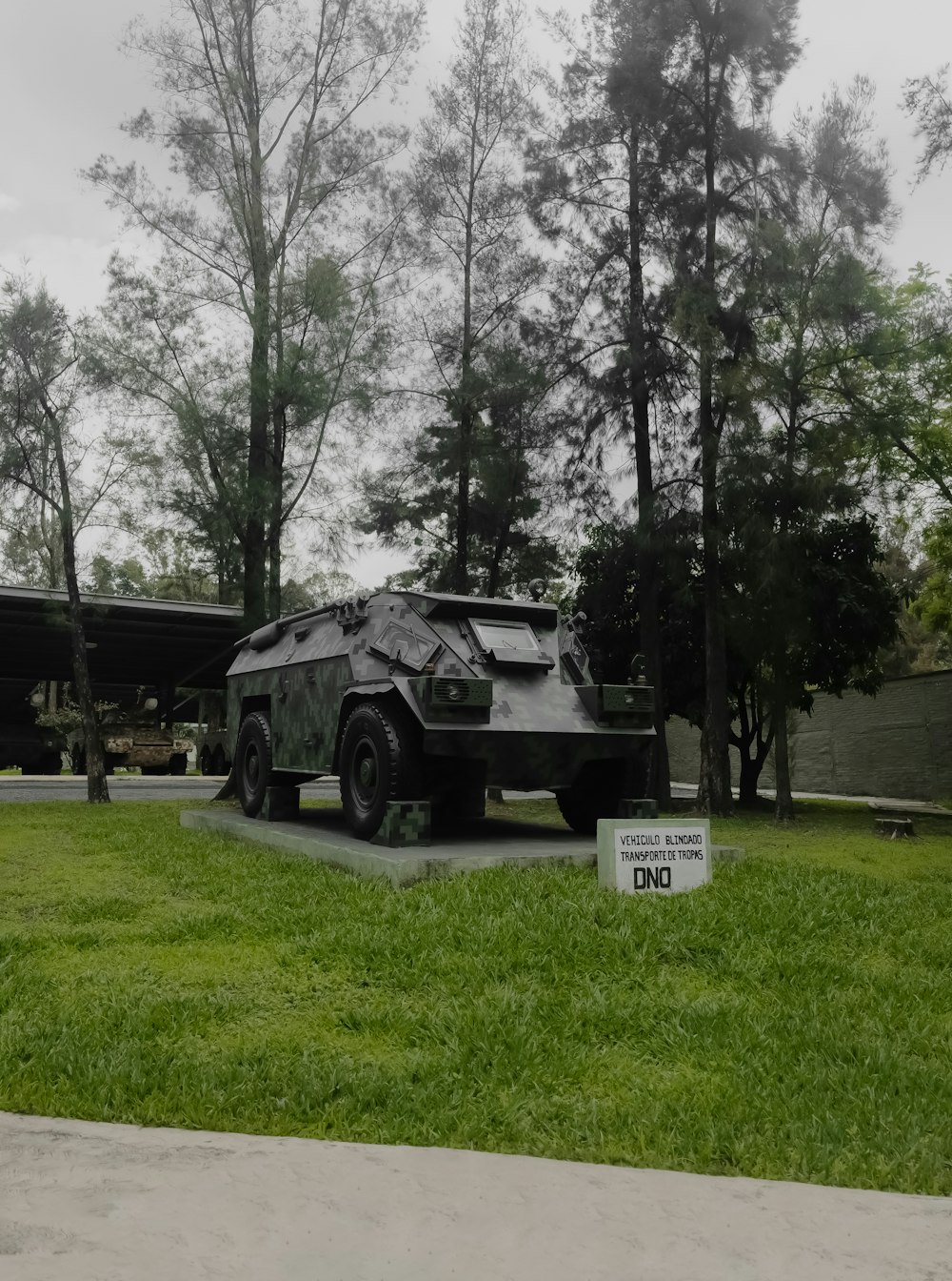 black and white utility truck on green grass field