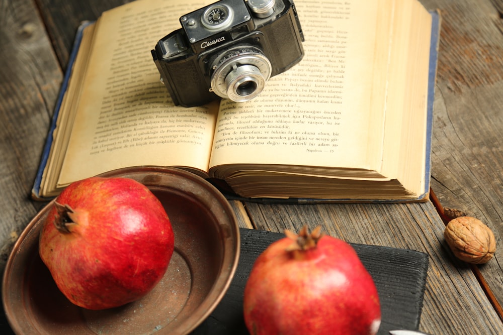 red apple fruit on book page