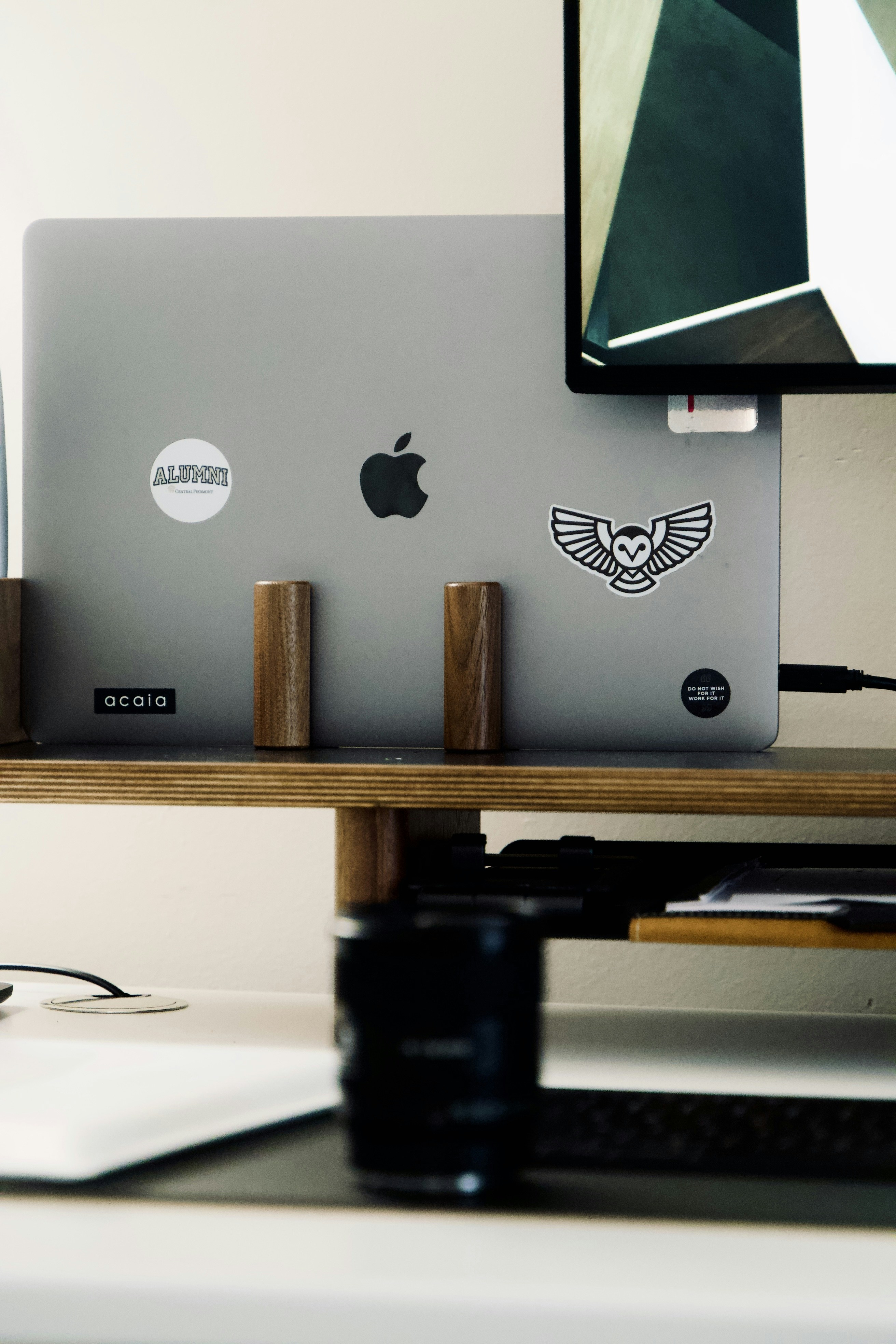 A set of laptop accessories including a stand, cooling pad, and docking station