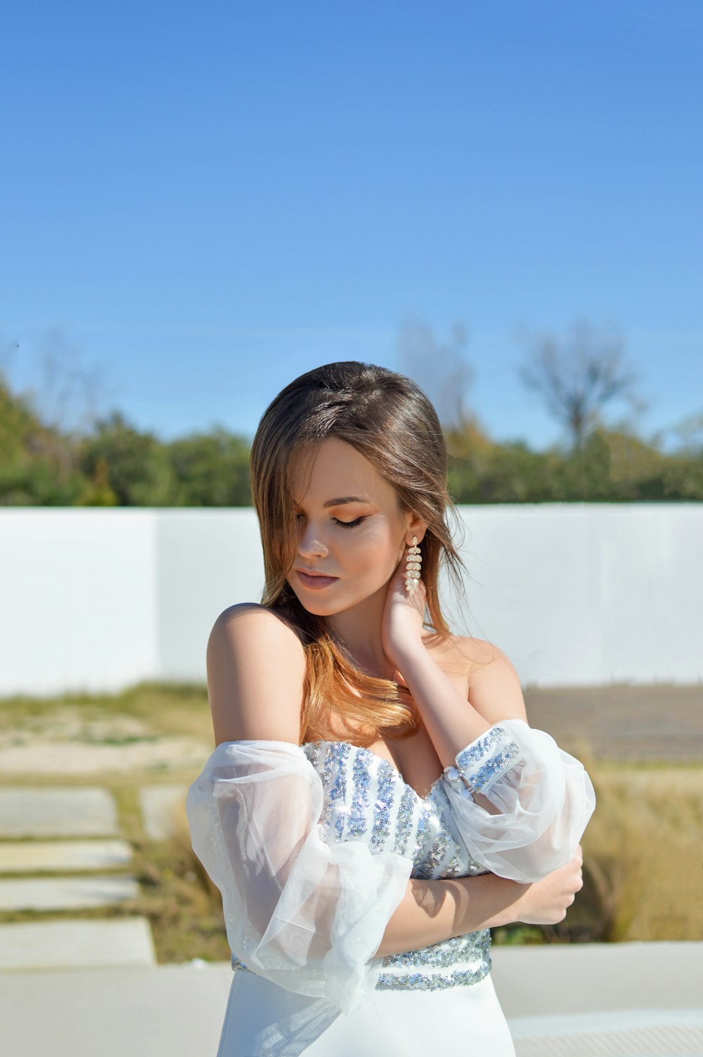 woman in white sleeveless dress