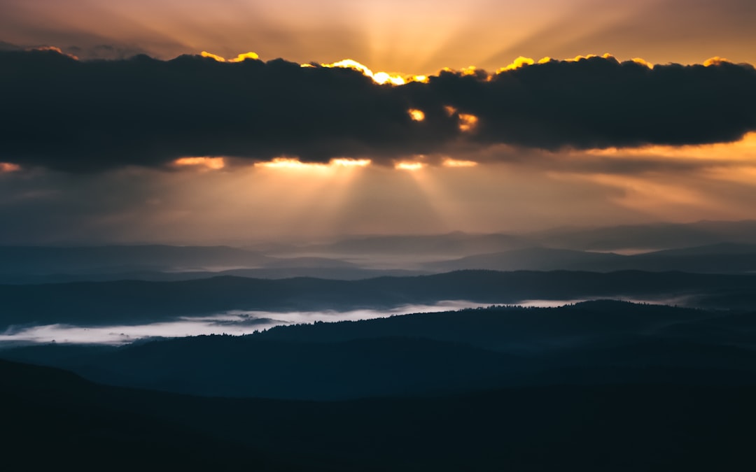 clouds over mountains during sunset