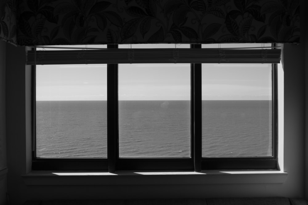 grayscale photo of a window