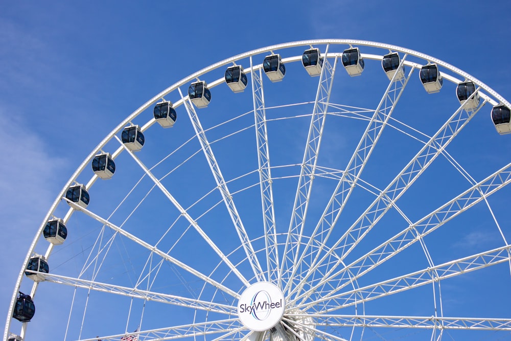 white ferris wheel under blue sky during daytime