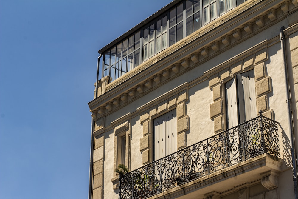 beige concrete building under blue sky during daytime