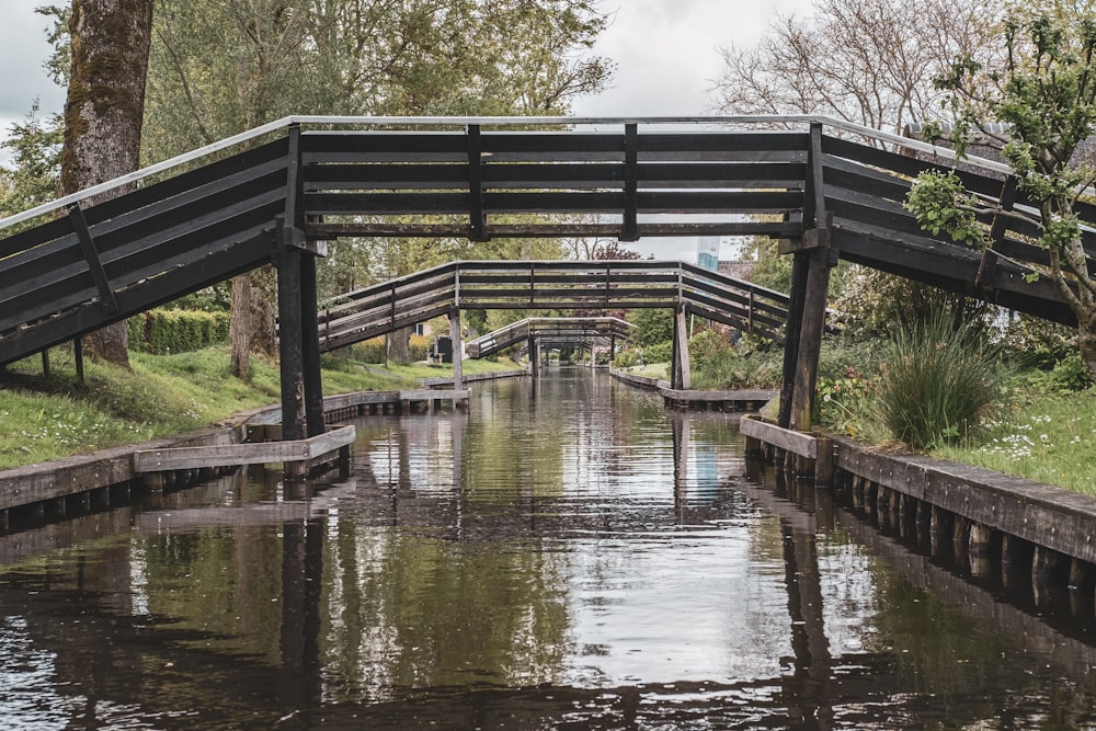 gray wooden bridge over river