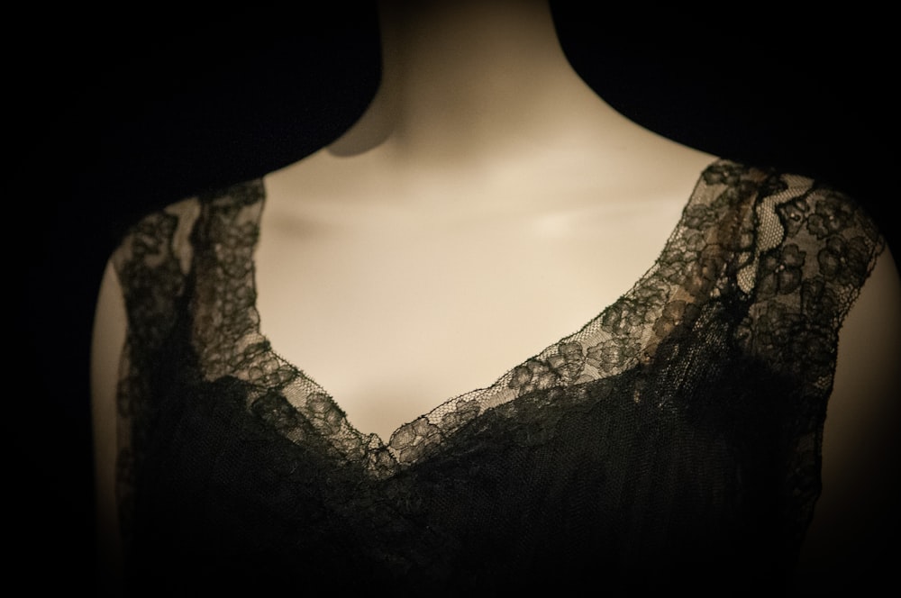 woman in black lace v neck shirt