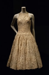 woman in beige floral sleeveless dress