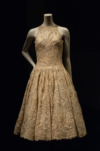 woman in beige floral sleeveless dress