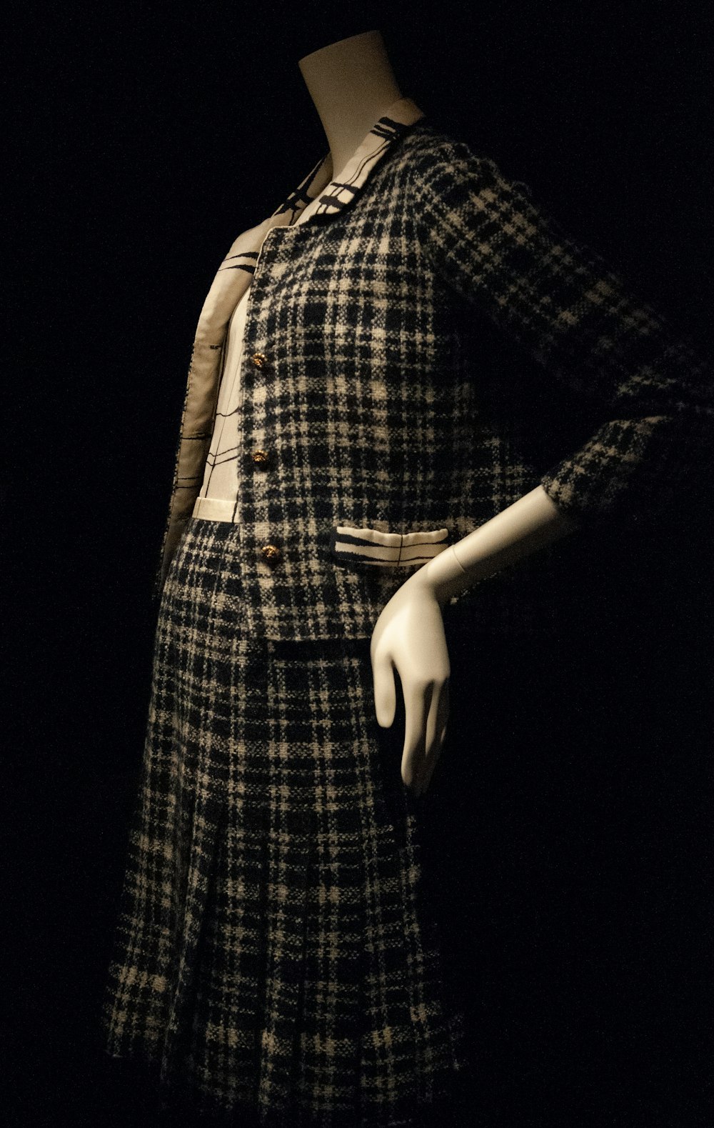 woman in black and white plaid dress