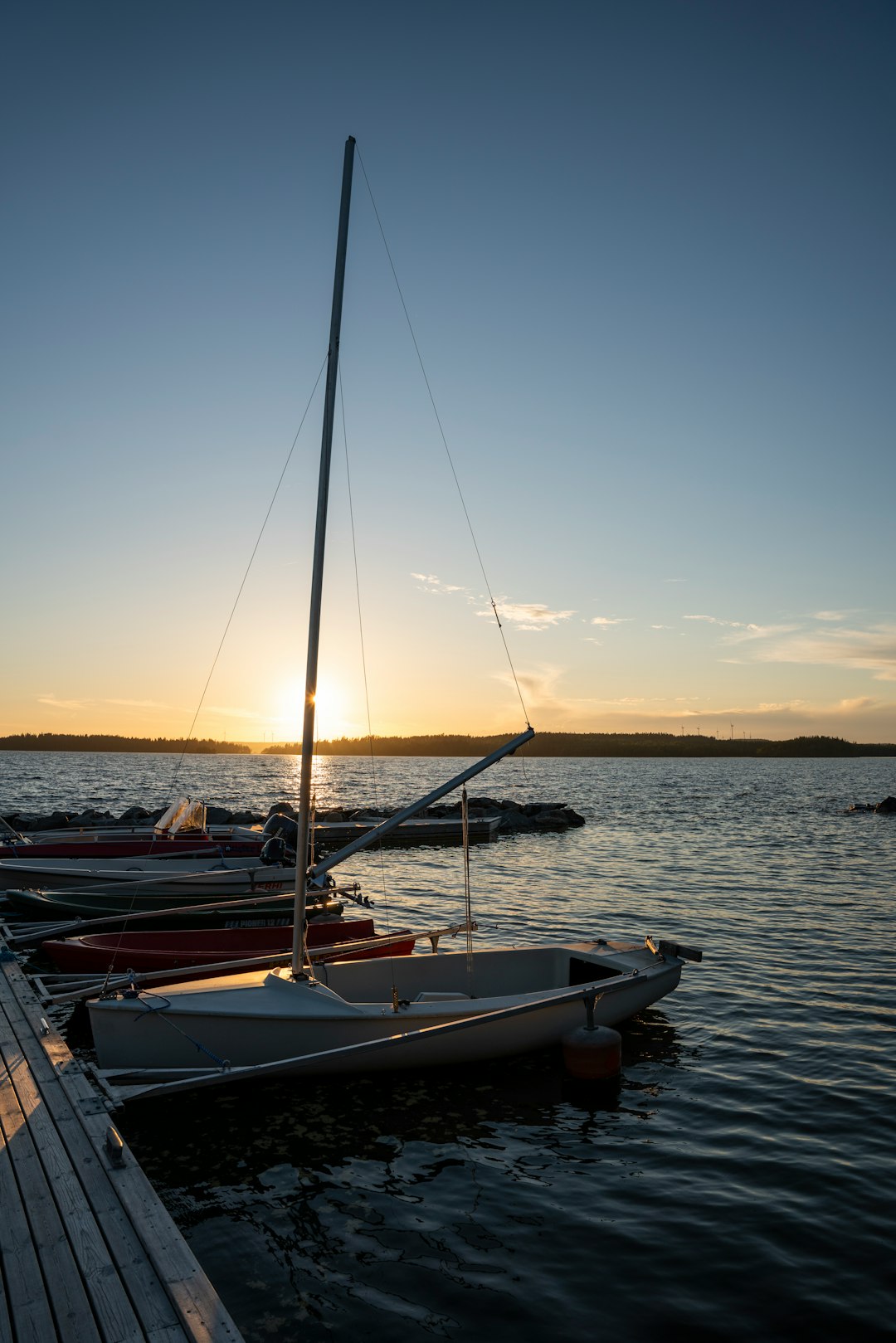 brown and white boat on sea during sunset