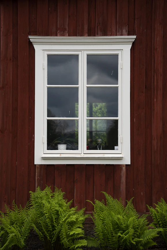 white wooden framed glass window