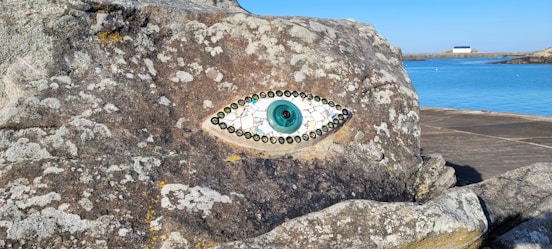 a rock with a glass eye on it
