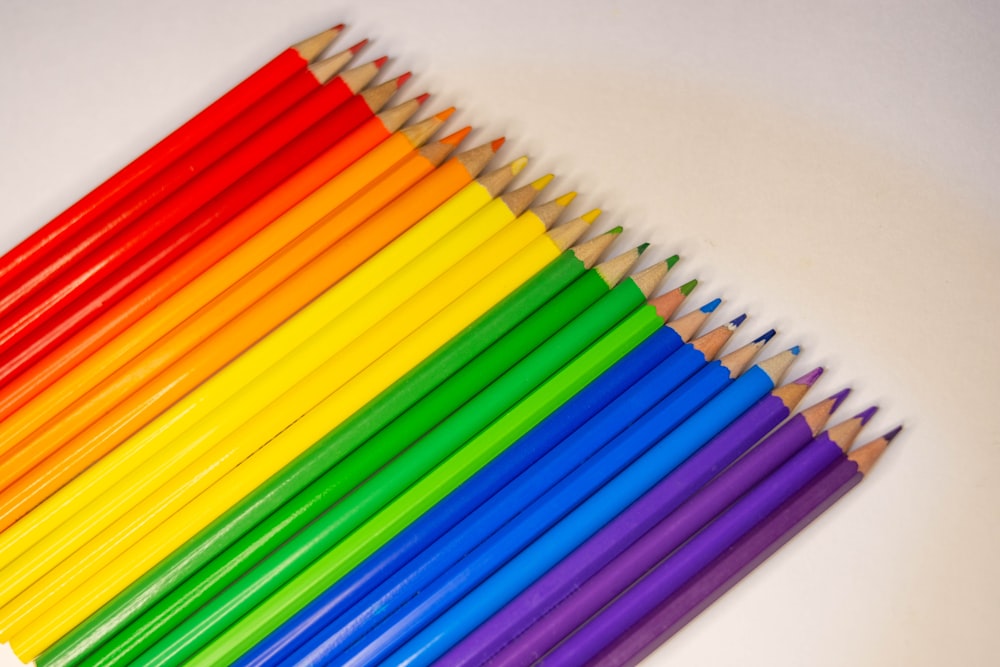 multi colored coloring pencils on white table