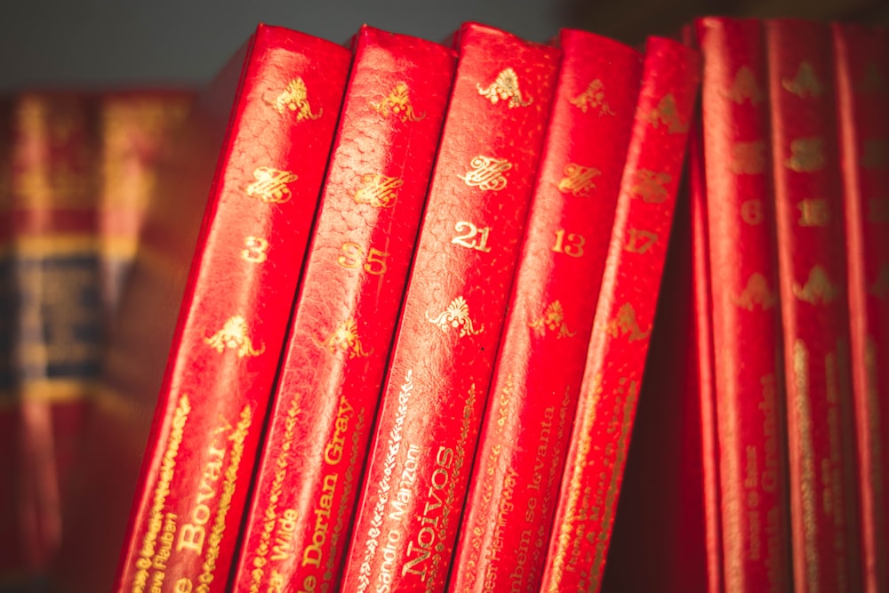 red and white hardbound books
