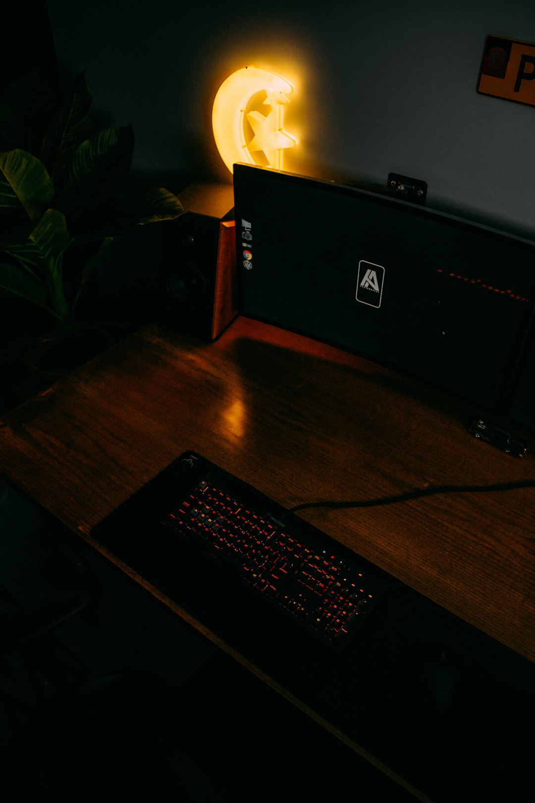 black computer keyboard on brown wooden table