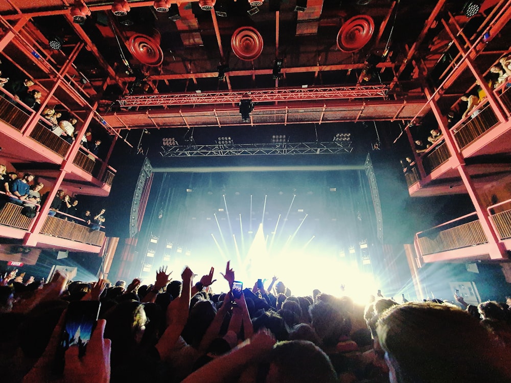 people standing on stage during nighttime