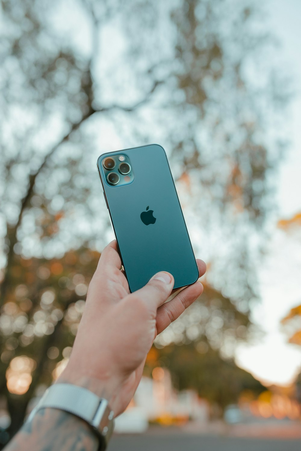 person holding blue iphone 5 c