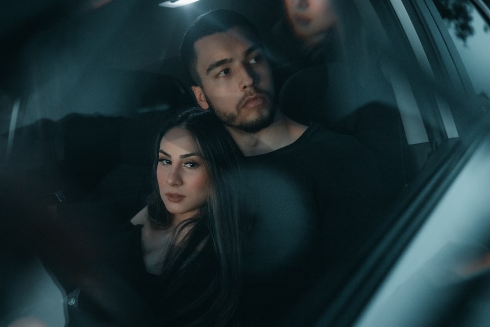man and woman in car