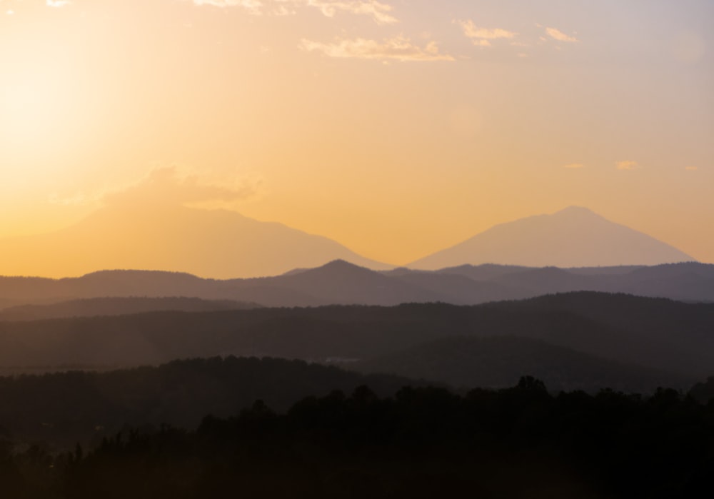 silhouette of mountains during sunset