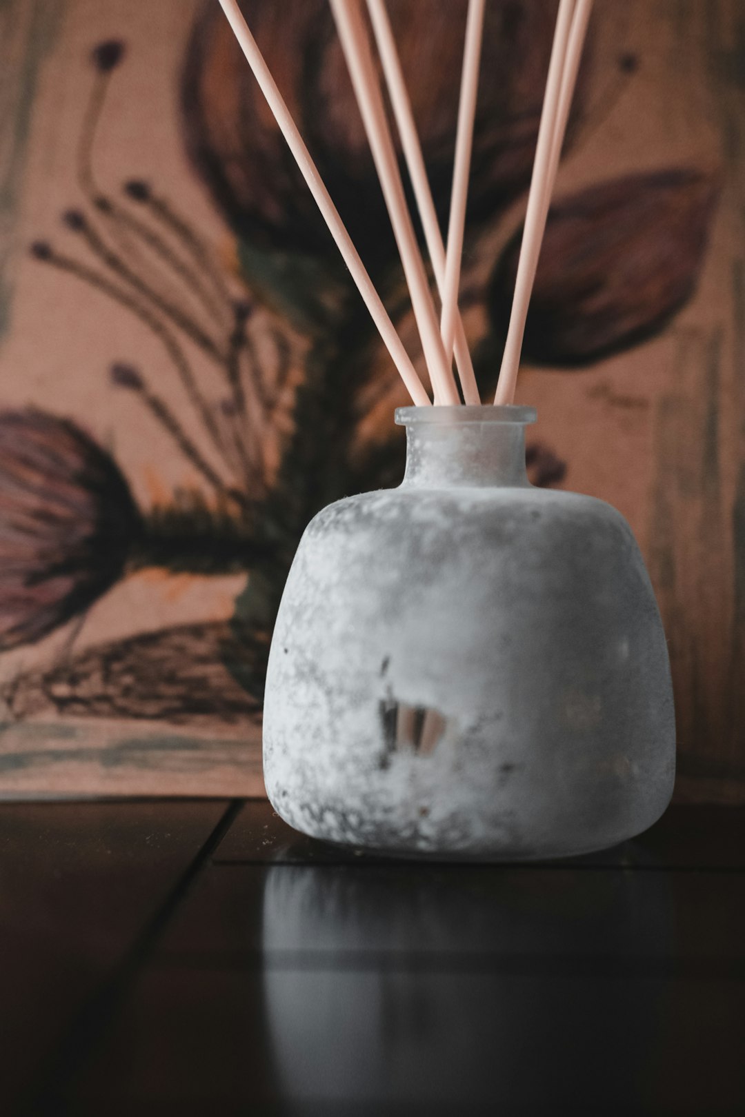 white ceramic vase with brown sticks