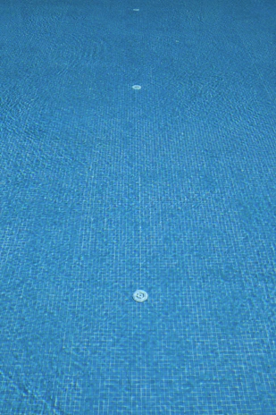 Detailed view of swimming pool system components such as overflow channels, pumps, and underwater lighting in the BIM model.