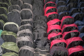 A collection of stylish backpacks on display outdoors.