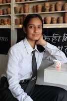 man in white and black pinstripe dress shirt
