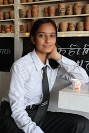 man in white and black pinstripe dress shirt
