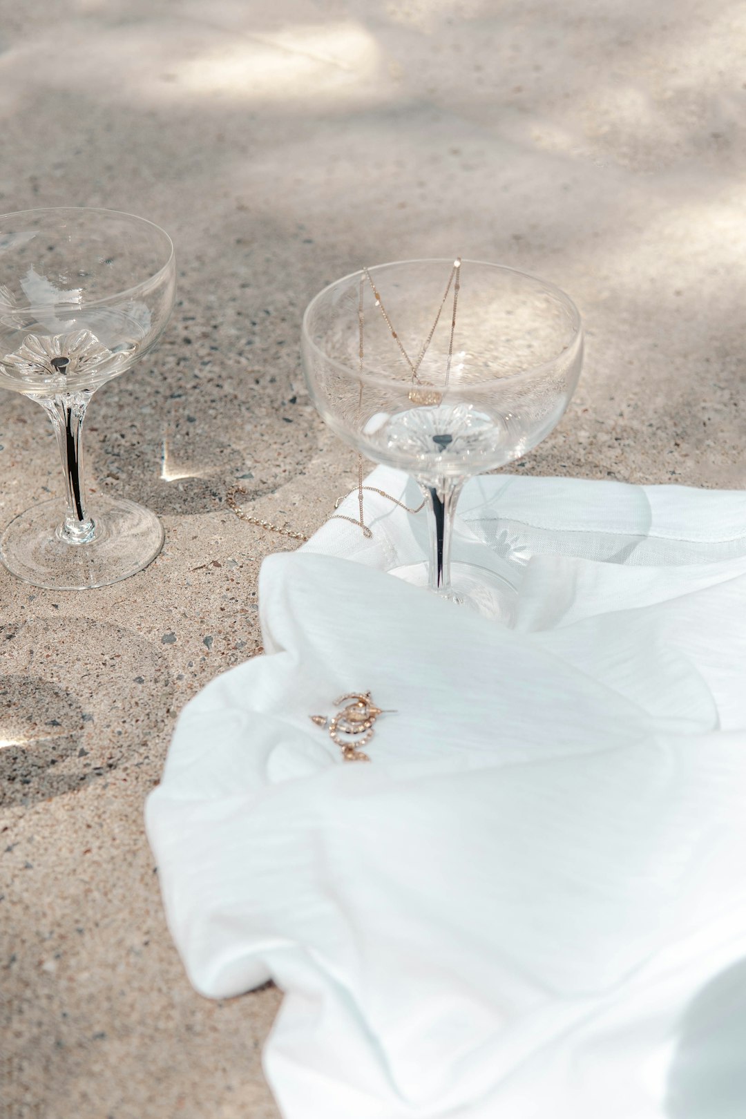 clear wine glass on white textile